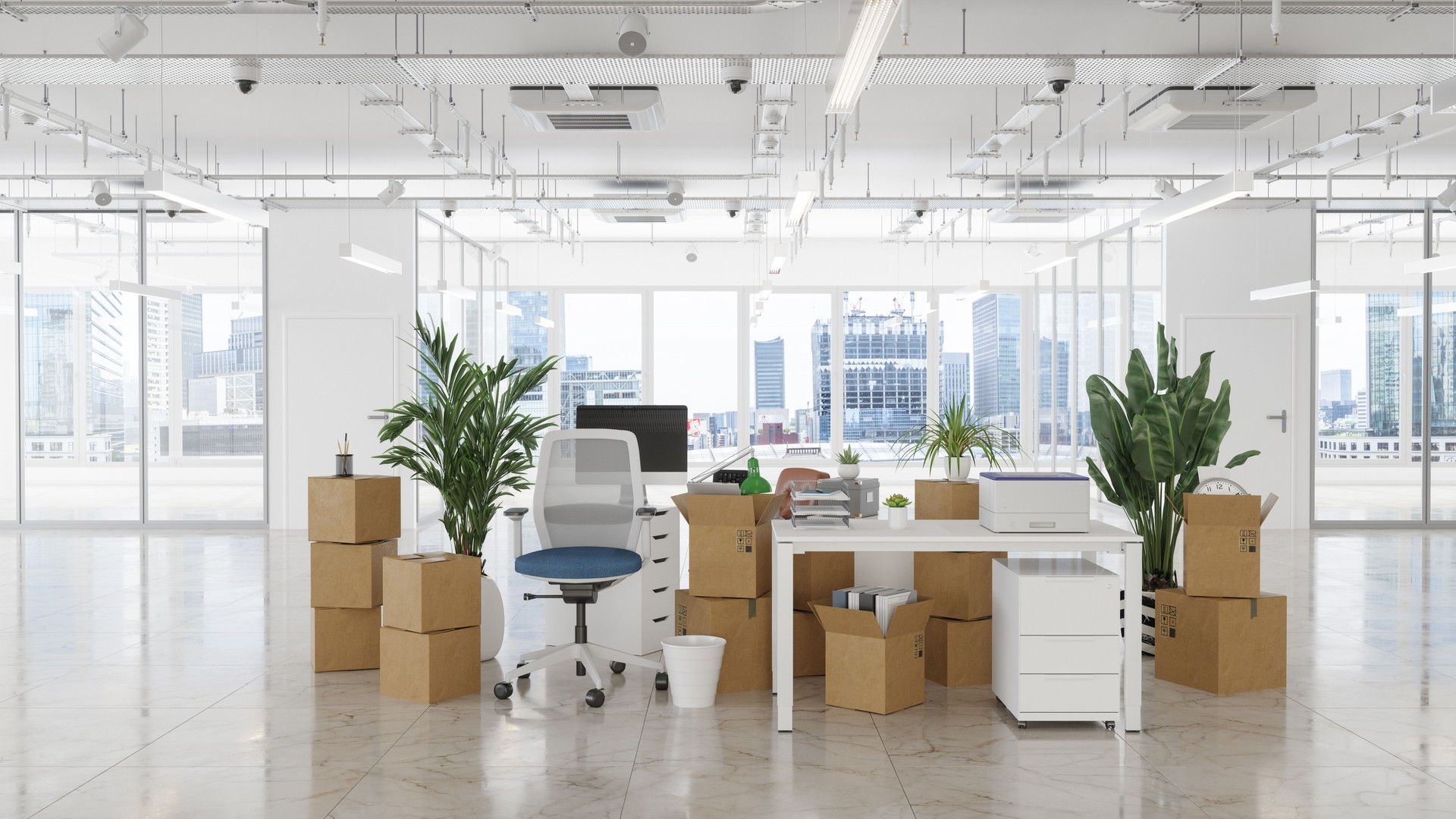 Empty Office With Chairs, Cardboard Boxes, Plants, Computers And Other Office Equipments. Moving To New Office Or Bankruptcy Concept