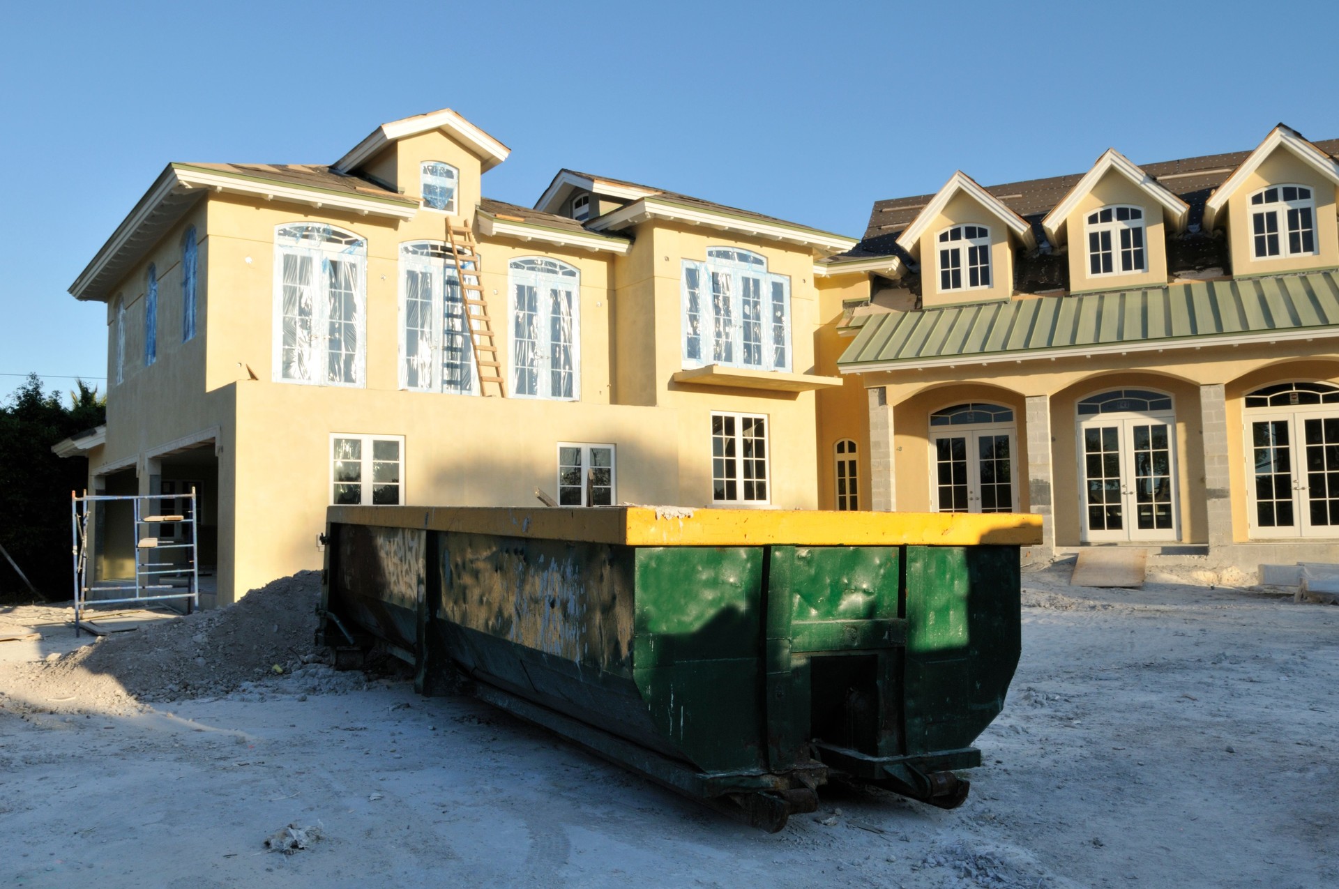 Dumpster and Construction House